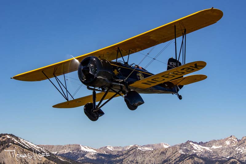 16-Ben-Scott_s-1930-Stearman-4E-pulled-along-by-the-world_s-oldest-flying-Pratt-_-Whitney-engine-over-the-Idaho_s-Sawtooth-Mountains-during-the-annual-Round-Engine-Round-Up.