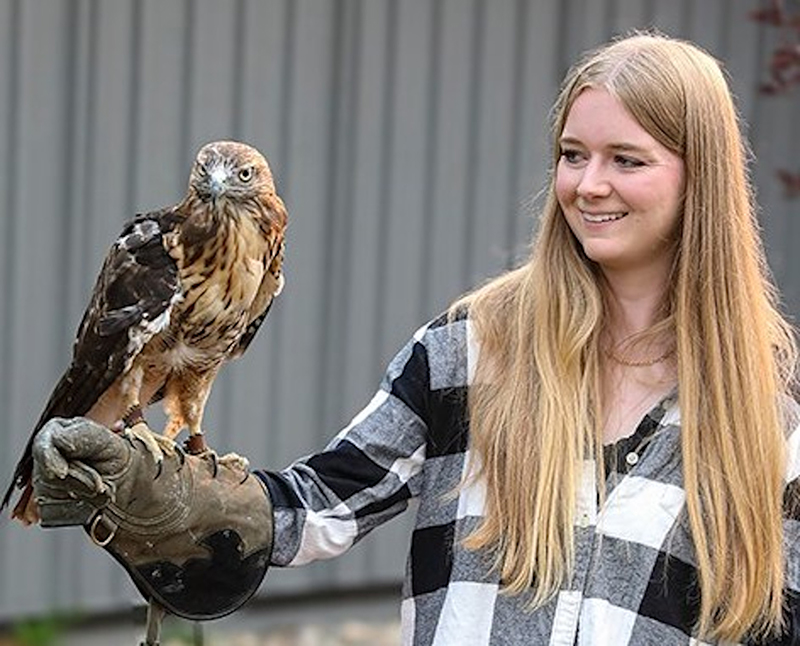 Manager-Genevieve-with-mascot-Qa_ya-a-redtail-hawk