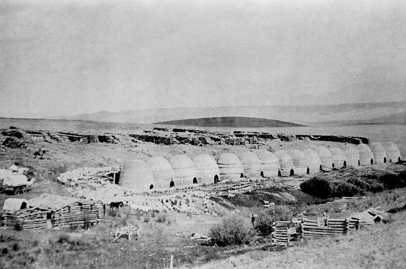 4.-Nicholia-charcoal-kilns-in-1890-Notice-the-40-acres-of-abandoned-wood-stacked-behind-the-kilns.