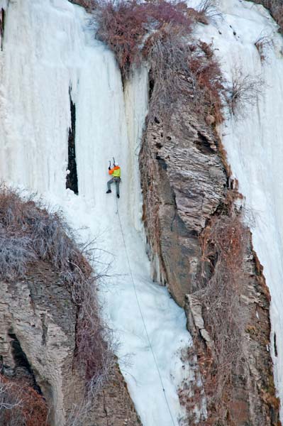 Elijah Weber ice climbing Lower Falls Middle which is rated WI-4 and located at Shoshone Falls in the Snake River Canyon near the city of Twin Falls in southern Idaho