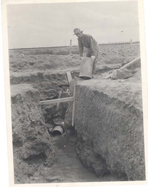 Laying seep tiles. 