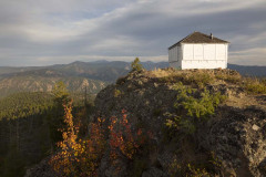 Idaho, Central, Salmon, North Fork. Granite Mountain lookout with autumn color.