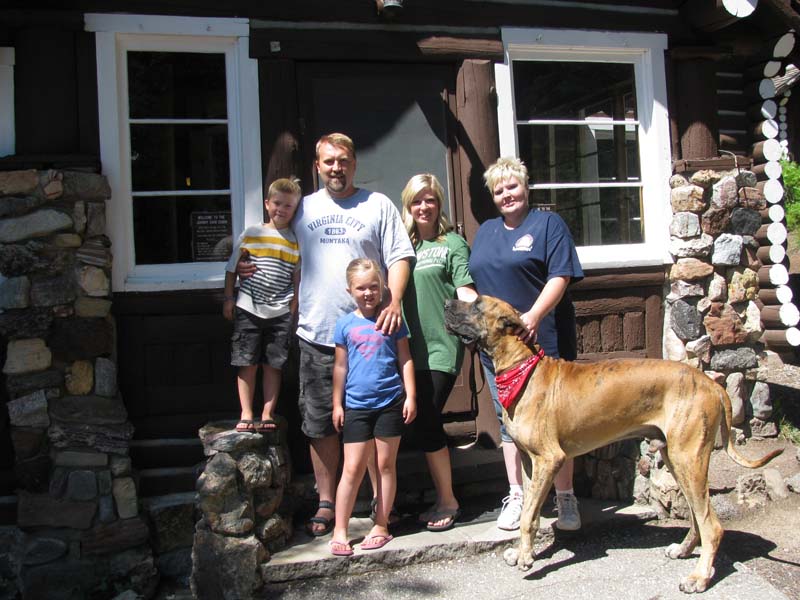 The Nelson family of Utah with their dog Max on a  recent visit to the cabin. By Geraldine Mathias