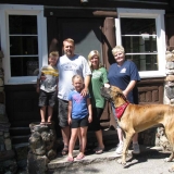 The Nelson family of Utah with their dog Max on a  recent visit to the cabin. By Geraldine Mathias