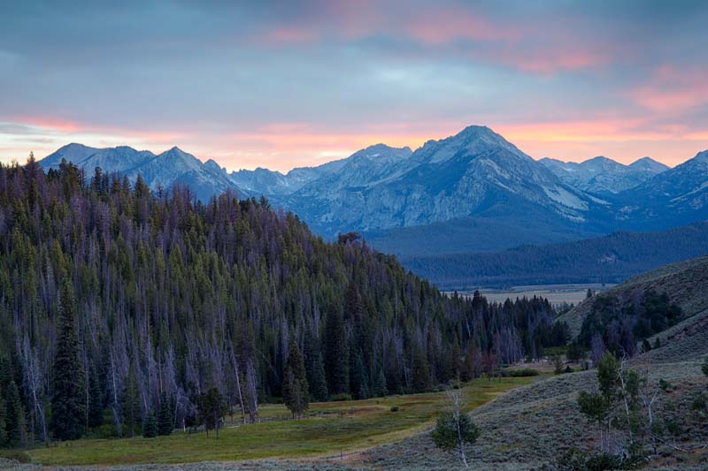 Idaho, South central, Stanley. Sunset over the Sawtooth range as viewed from the Boulder Mountains in summer.